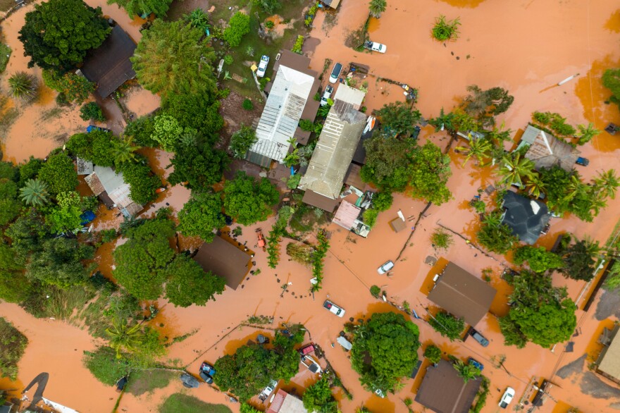 An aerial view of homes surrounded by floodwaters in Waialua, Hawaiʻi, Friday, March 20, 2026.