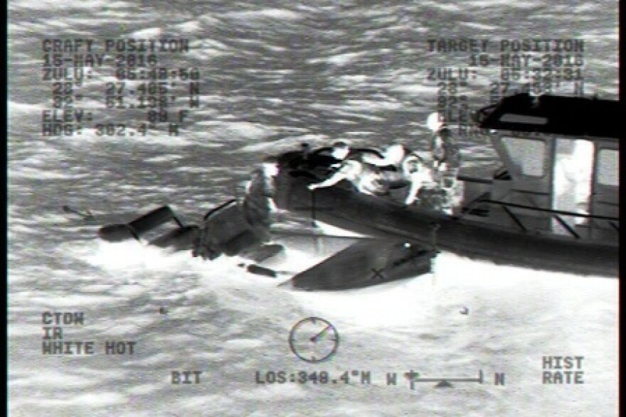 A 27-foot Utility Boat-Medium boat crew from Station Yankeetown, Florida, rescues two adults and two children from the pictured 18-foot flooded boat 10 miles west of Aripeka, Florida, Sunday, May 15, 2016. The people were transported safely to shore with no reported injuries. (U.S. Coast Guard photo)