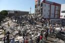 Residents and rescue workers search through the rubble of a collapsed building after an earthquake struck Cali, Colombia, Monday, Aug. 10, 2026. (Santiago Saldarriaga/AP)