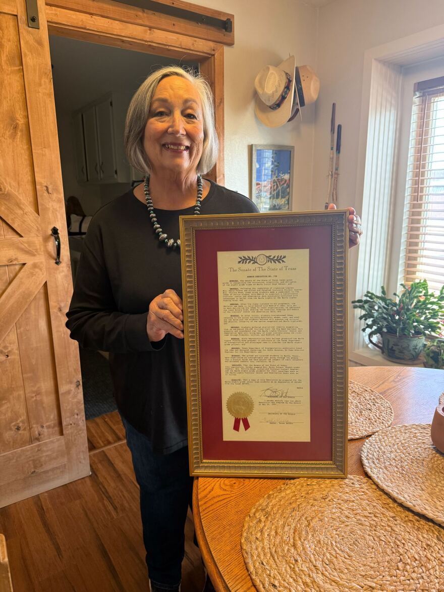 Felicia Locke with the Texas State Senate Resolution that made the Marfa Lights Viewing Center official.
