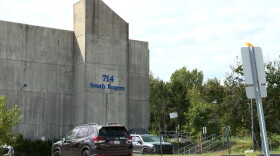 A concrete building and parking not