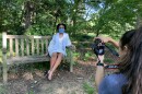 UNC-Chapel Hill graduating senior Amy Martin wears a homemade Carolina facemask during her graduation photoshoot in Coker Arboretum last week.