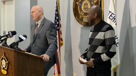 Indianapolis Fraternal Order of Police President Rick Synder speaks to the media as Rev. Charles Harrison, president of Ten Point Coalition looks on.