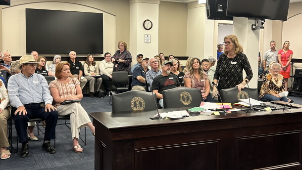 Janet Garrison from Mason County spills letters of support from people across the country who support their efforts to stop data center development in their rural community.