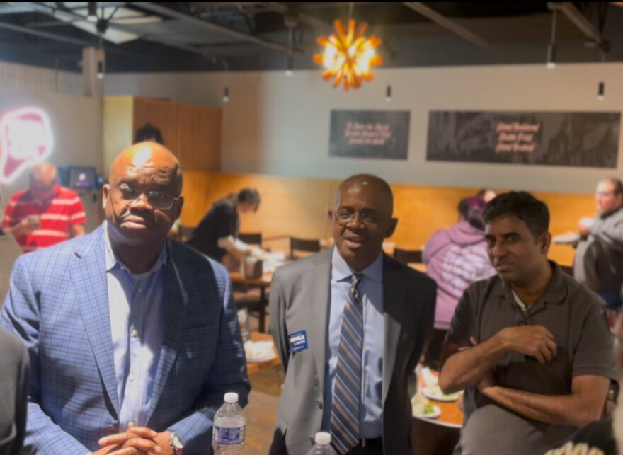 Bloomington Mayor Mboka Mwilambwe with supporters Tuesday night at Bonchon.