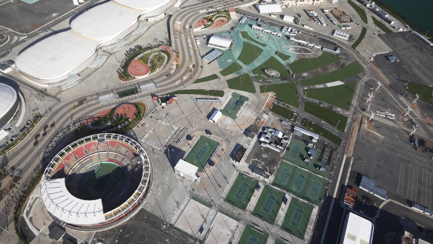 Some remaining tennis courts stand next to the main tennis stadium in Olympic Park in Rio de Janeiro last year. Nearly two years after Rio hosted the first Olympic games in South America, many of the costly venue sites are shuttered or underused amid a deep economic crisis in the city.