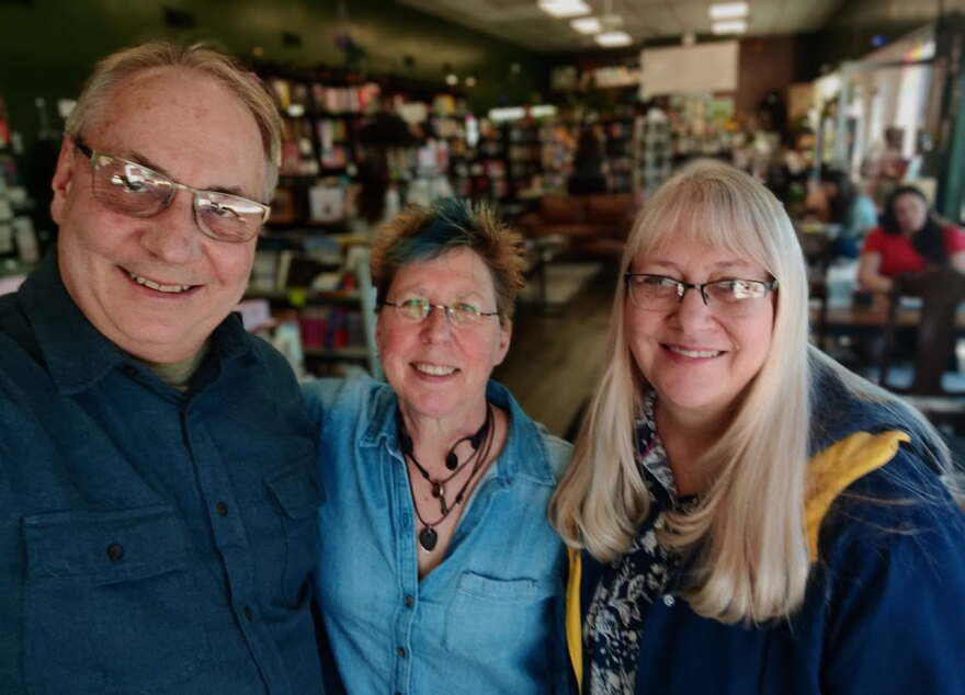 Moline-based filmmakers Kelly Rundle (left) and Tammy Rundle (right) with QC singer-songwriter Lojo Russo, who will write and record a new song for the documentary.