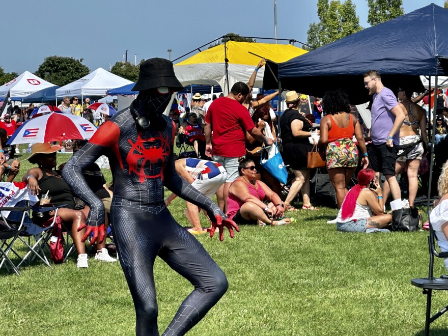 Popular Marvel superhero Miles Morales performs a Spider-Man pose at the 2023 Puerto Rican Festival.