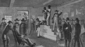 A slave auction  in Virginia. (Rischgitz/Getty Images)