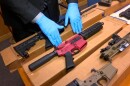 In this file photo taken Wednesday, Nov. 27, 2019, is Sgt. Matthew Elseth with “ghost guns” on display at the headquarters of the San Francisco Police Department in San Francisco.