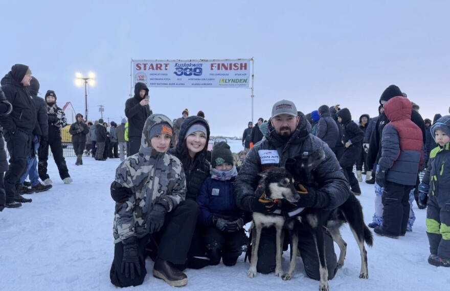 Pete Kaiser photographed with his family and lead dog after his tenth, historic win of the Kuskokwim 300 Sled Dog Race.