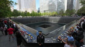 A U.S. Army warrant officer stands by a reflecting pool during a memorial on the 25th anniversary of the September 11, 2001, terrorist attacks, Friday, Sept. 11, 2026, in New York. 
