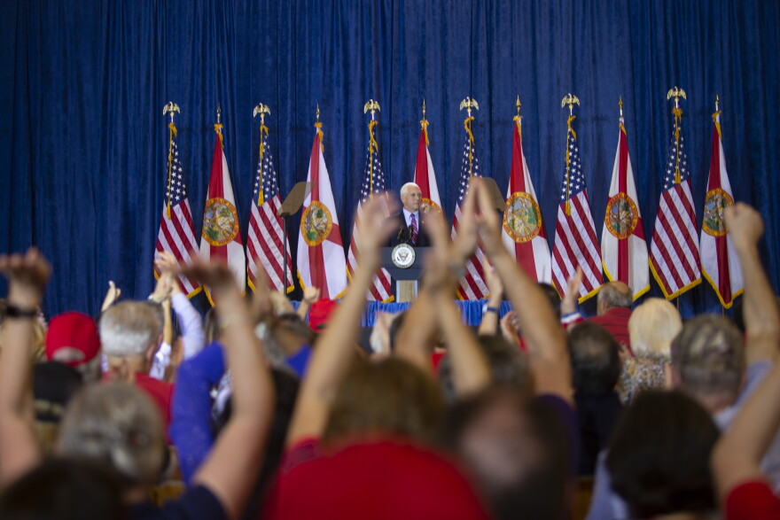 Crowds gather at a campaign rally in Tampa with Vice President Mike Pence