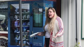 Kristin Wise explains how to use a new community health vending machine during an unveiling ceremony on Wednesday, July 22, 2026 in Seward, Alaska.