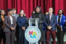 Superintendent of New Orleans Public Schools Fateama Fulmore (center) announces the district's improved letter grade — a B up from a C — on Nov. 20, 2025.