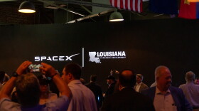 SpaceX and Louisiana Economic Development logos appear on a screen inside an event hall in downtown Abbeville, Louisiana, during the SpaceX announcement on Tuesday, August 25, 2026. 