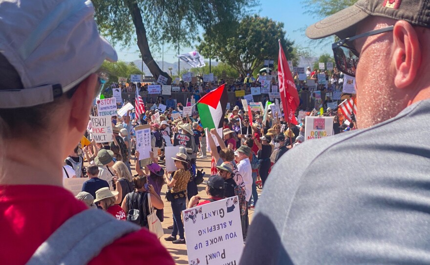 Demonstrators at the Arizona Capitol protesting and marching against actions taken by the Trump administration on May 1, 2025.