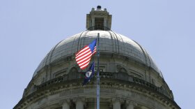 FILE - The American flag flies at full staff in front of the Capitol Rotunda in Frankfort, Ky., Wednesday, July 23, 2008. Kentucky would make the death penalty off-limits for some defendants diagnosed with severe mental illnesses under a bill that won final legislative approval on Friday, March 25, 2022. The Republican-led Senate voted 25-9 to send the measure to Democratic Gov. Andy Beshear, capping a long effort led by death penalty opponents to restrict the use of capital punishment. (AP Photo/Ed Reinke, File)