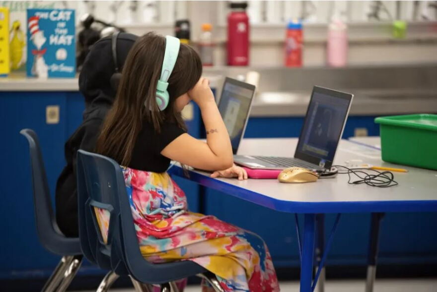 First graders work on assignments on laptops at Epic Charter Schools' Stonegate Virtual Learning Center in Oklahoma City on Feb. 28, 2023.