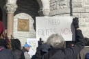 Advocates gather outside Syracuse City Hall calling on officials to declare a state of emergency over lead levels in city water, Nov. 12.