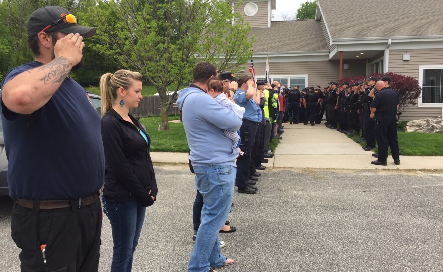 Mourners of Ciro, a retired police dog who had to be euthanized.