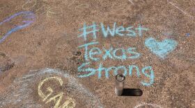 A sidewalk is filled with chalk messages following a prayer service on Sunday, Sept. 1, in Odessa.