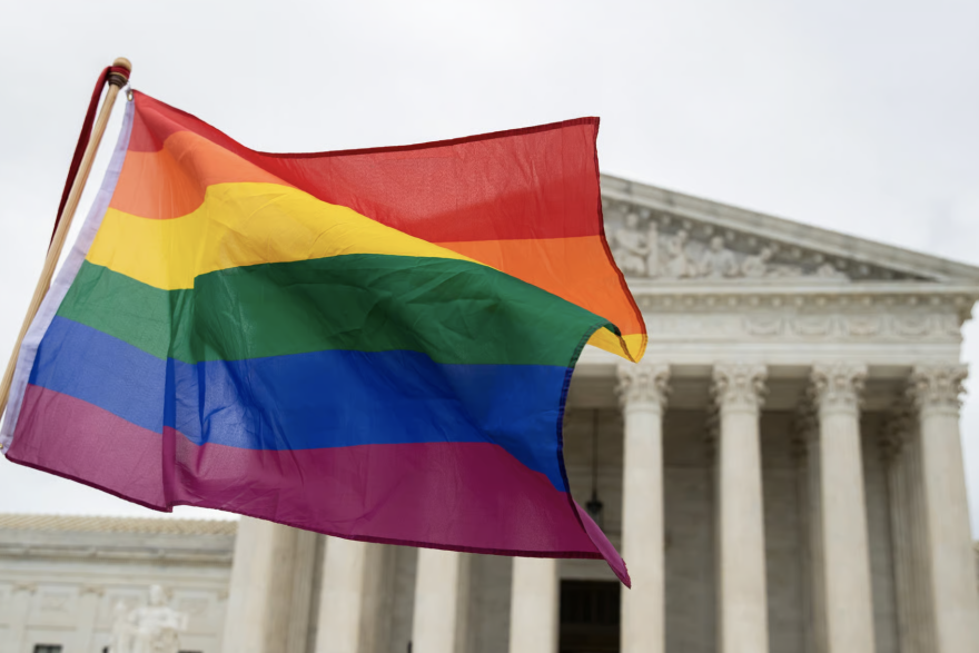 FILE - A pride flag in front of the U.S. Supreme Court, Oct. 8, 2019, in Washington, D.C.