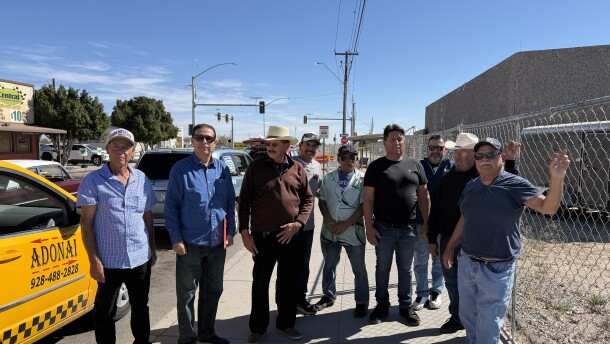 A group of taxis are gathered together near the San Luis port of entry, where drivers wait for passengers crossing the border.