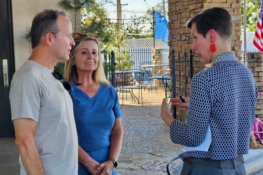 Mary Ann Perkins, right, Democratic candidate in the 100th Missouri House District, speaks with Joe and Kay Wiese on Oct. 7 as they volunteer to place yard signs out for her campaign.