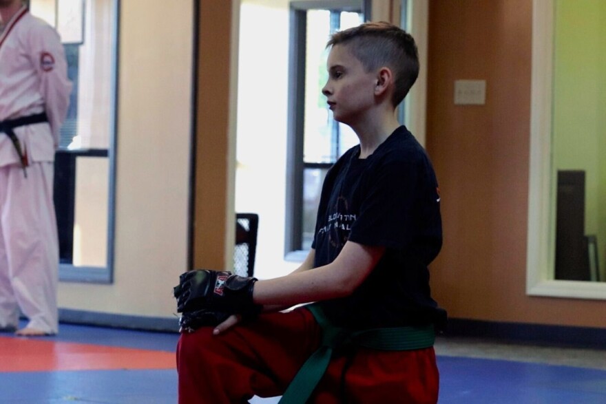 Skyler Wampler listens to directions at a martial arts lesson in Bloomington.