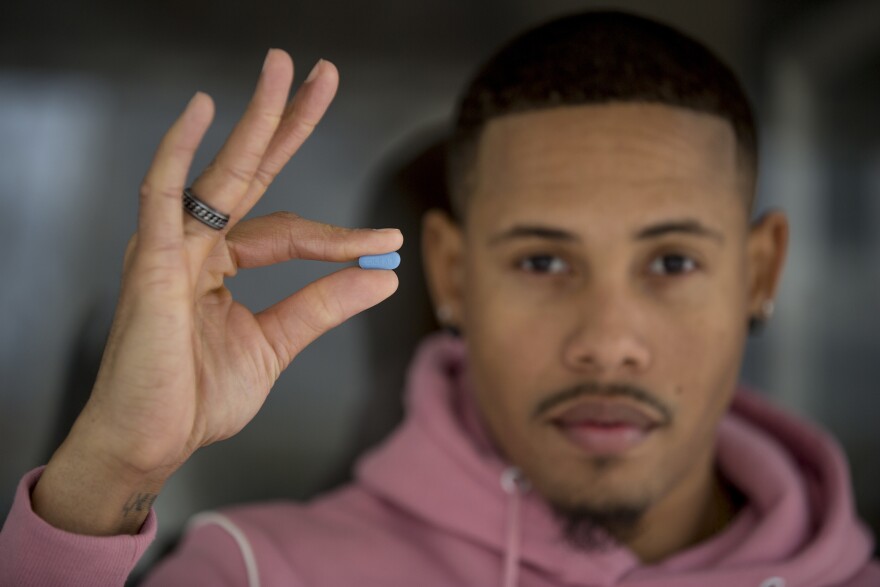 D.C. resident Ricardo Cooper is gay and HIV-negative. He says he's been taking a daily blue PrEP pill for the last six months, with few side effects. The drug gives him peace of mind, he says.