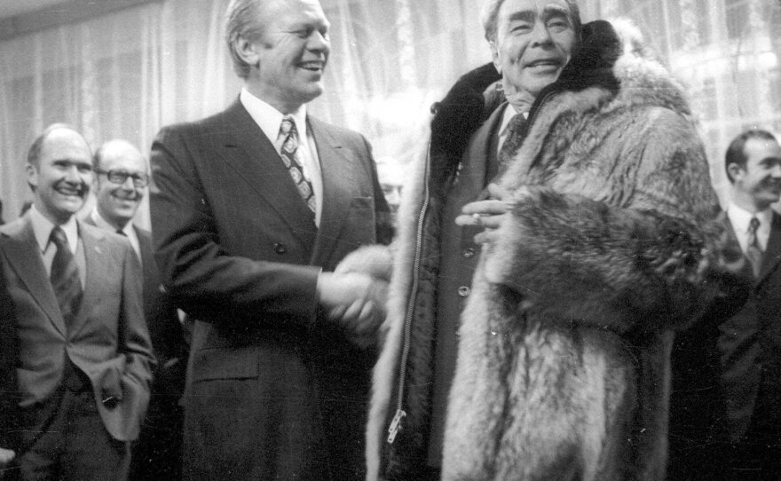 President Gerald Ford greets Brezhnev in 1974 after the Soviet leader tried on Ford's fur coat at a summit in what's now Vladivostok, Russia.