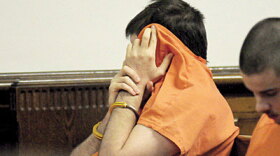 Bivens hides his face during sentencing.