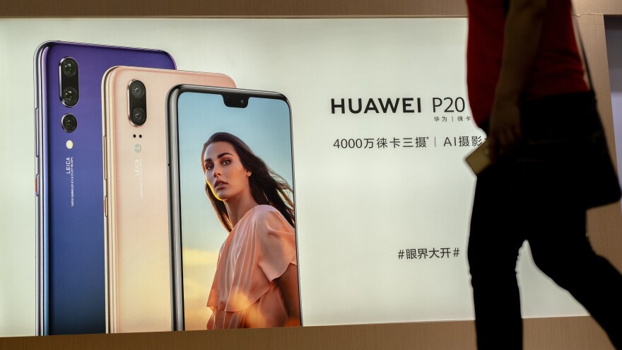 Facebook's data-sharing deals with device-makers included China's Huawei — a company viewed with suspicion by U.S. intelligence agencies. Here, an ad for the Huawei P20 smartphone is seen in China last month.