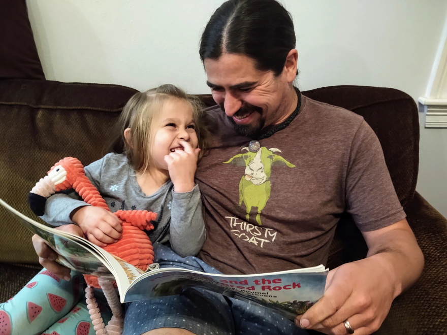 Leah Walsh and her father, Thomas, share a laugh over Anansi's antics.