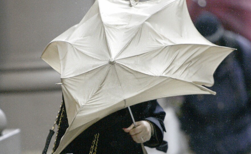 Umbrella attack during Hurricane Wilma in New York City, 2005. 