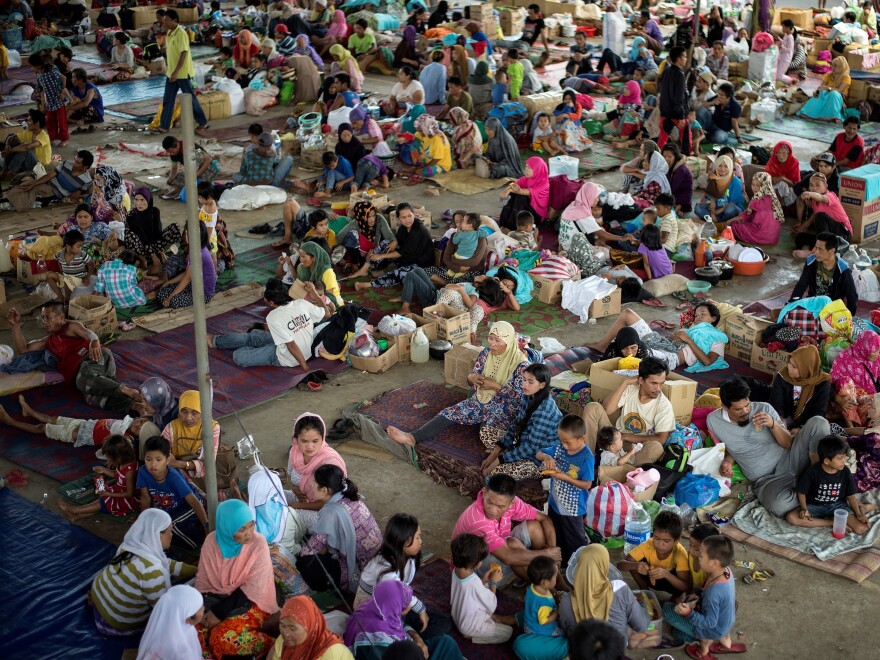 Evacuees from Marawi gather in nearby Lanao del Sur on Monday. Up to 2,000 civilians reportedly remain trapped in Marawi, caught in fighting between government forces and militants.