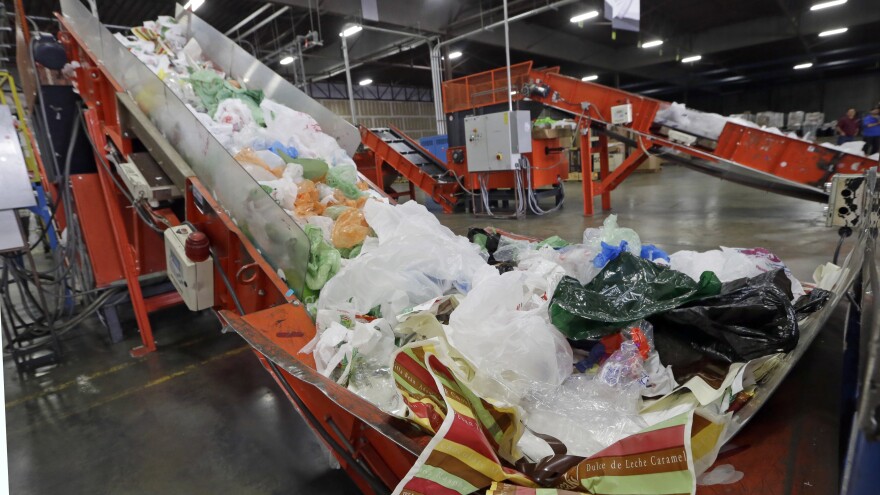 California Gov. Jerry Brown has signed the nation's first statewide ban on single-use plastic bags. Here, mixed plastic items are seen at a recycling plant in Vernon, Calif., earlier this year.