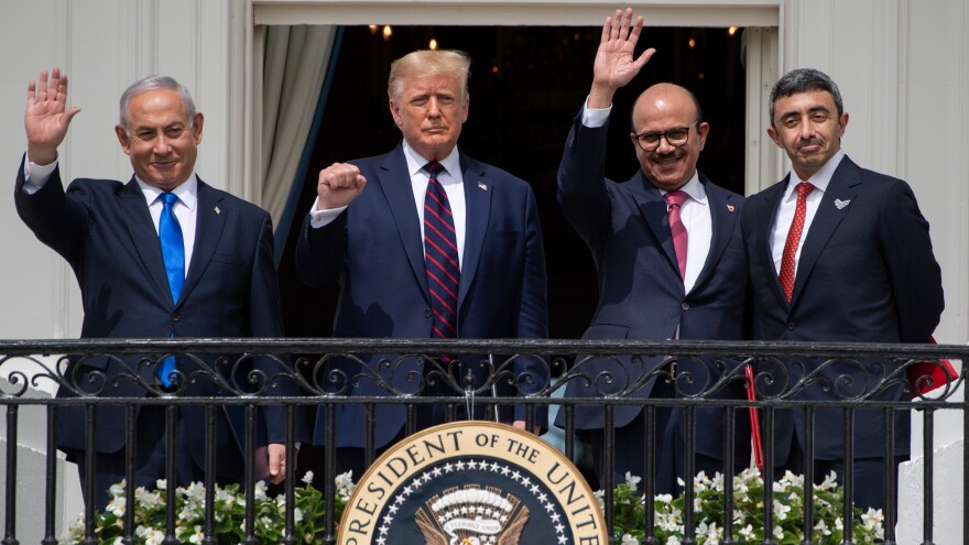 Israeli Prime Minister Benjamin Netanyahu (from left), President Trump, Bahraini Foreign Minister Abdullatif bin Rashid Al Zayani and Emirati Foreign Minister Abdullah bin Zayed Al Nahyan wave from the Truman Balcony at the White House. The group participated in the signing of the Abraham Accords on Tuesday.