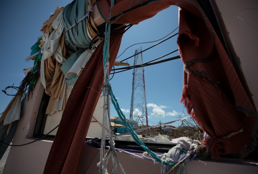 Debris frames a cell tower in Marsh Harbour. The official death toll in the Bahamas now stands at 50, and officials expect it to keep rising.
