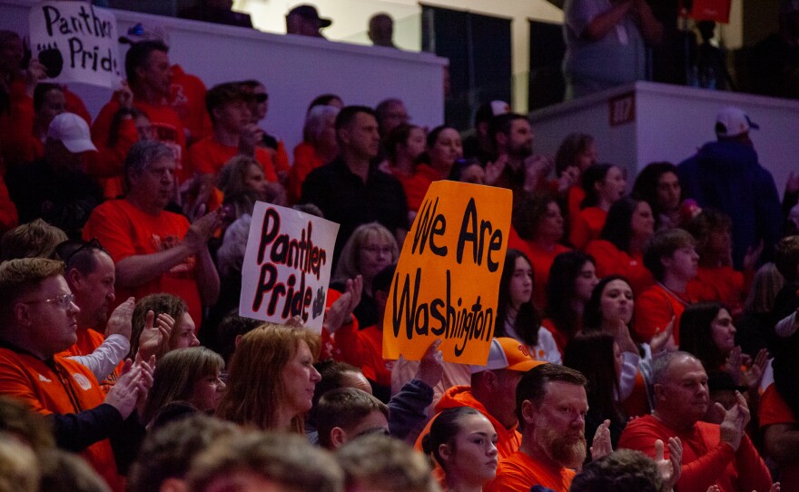 Girls high school basketball players inside an arena