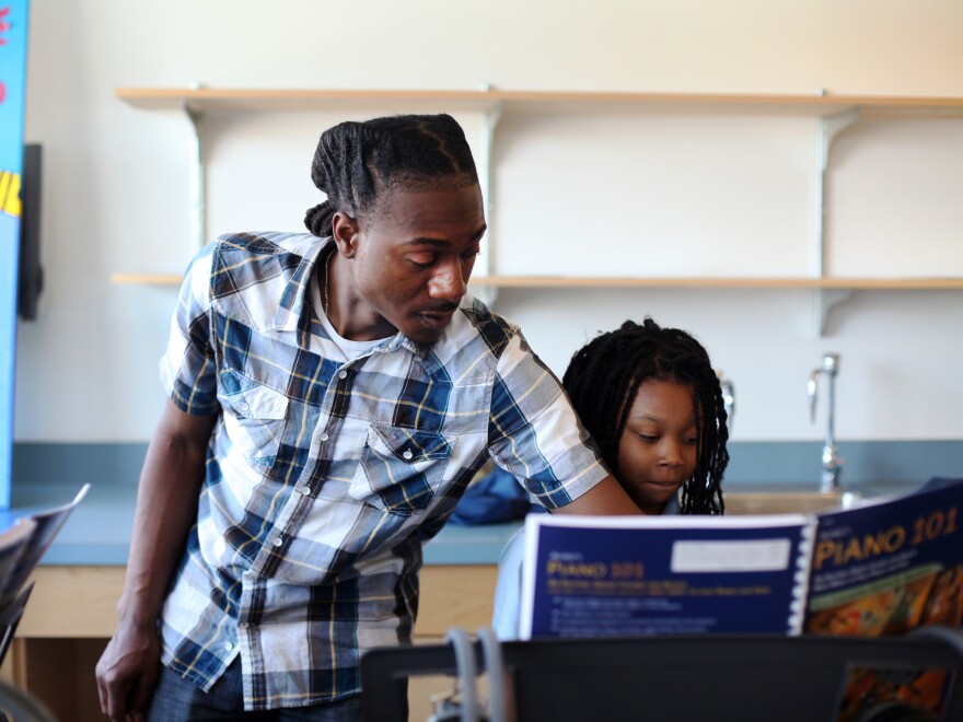 Anthony Jones teaches keyboard at Savoy, a class made possible, in part, by a donation from Yamaha.