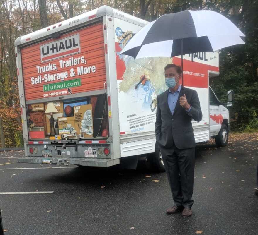 Gov. Ned Lamont in Newtown in October celebrating a hot housing market brought on by New York City residents moving here during the pandemic.