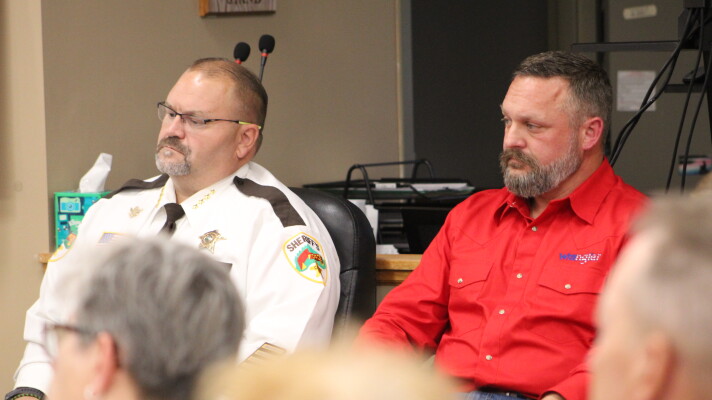 Sheriff Bryan Welk and his opponent, Deputy Aaron Ammerman, watch the forum preceding the sheriff's candidate forum Sept. 8, 2026, at Sylvan Town Hall in southern Cass County.
