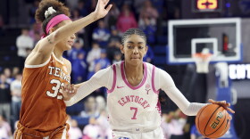 Texas' Ndjakalenga Mwenentanda, left, defends Kentucky's Teonni Key (7) during an NCAA college basketball game in Lexington, Ky., Thursday, Feb. 13, 2025. (AP Photo/James Crisp)