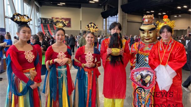 Local students dress up as Chinese princesses and money gods to celebrate Lunar New Year at the Spokane Convention Center.