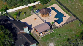 Louis and Raye Ellen Minardi have a gun shaped pool in the backyard of their home on Gunn Highway in Odessa, just north of Tampa, as seen in this aerial on January 24, 2023.