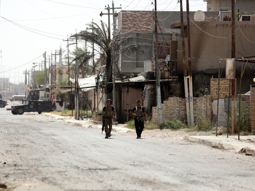 Members with Iraqi counter-terrorism forces patrol Fallujah, Iraq last Monday, June 27, 2016. The city was declared "fully liberated" from the Islamic State group.