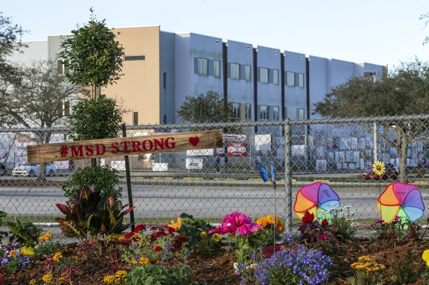 A memorial to the victims is seen outside Marjory Stoneman Douglas High School in Parkland, Fla., on Feb. 14, 2019, during the one-year anniversary of the school shooting.