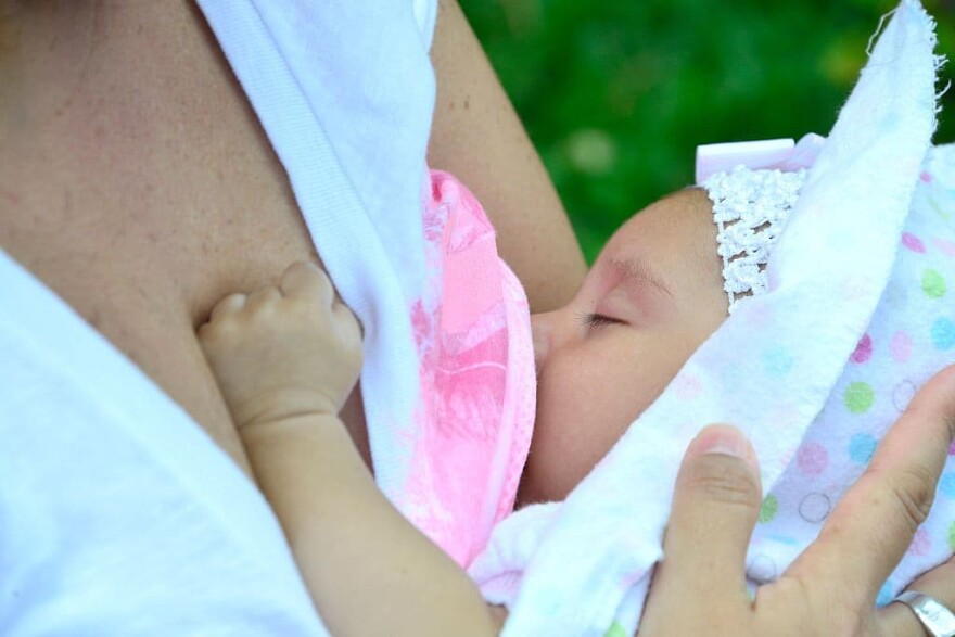 Woman breastfeeds  outside the Legislative Assembly in San Jose on August 3, 2016 (Ezequiel Becerra/AFP/Getty Images)